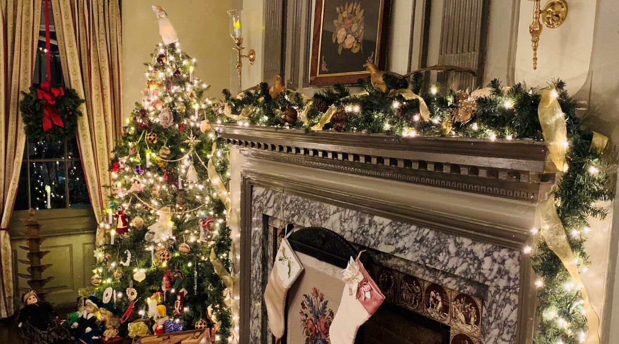 Stockings hang from the fireplace next to a colorfully decorated Christmas tree at Mesier Homestead in Wappingers Falls 